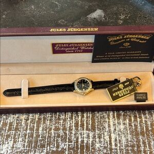 Jules Jurgensen Women's Gold and Black Watch
Brand New!